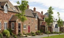 A photograph of a cottage style house