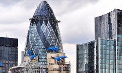 A photograph of the London skyline with the Gherkin building